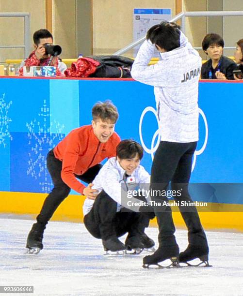 Yuzuru Hanyu of Japan, Shoma Uno of Japan and Misha Ge of Uzbekistan share a laugh during a practice session ahead of the Figure Skating Gala...