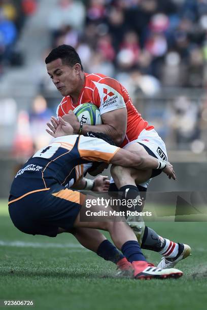 Hosea Saumaki of the Sunwolves is tackled by Christian Lealiifano of the Brumbies during the Super Rugby round 2 match between Sunwolves and Brumbies...