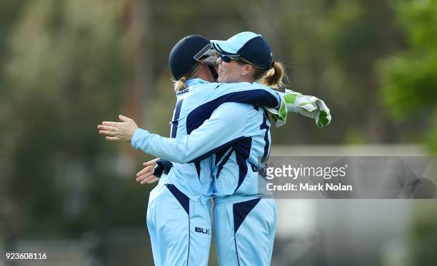 Allyssa Healy and Alex Blackwell of NSW embrace after winning the WNCL Final match between New South Wales and Western Australia at Blacktown...