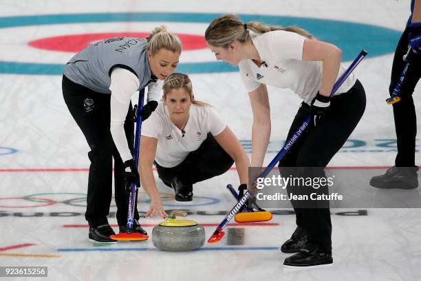 Vicki Adams of Great Britain throws a stone surrounded by Anna Sloan and Lauren Gray during the women's curling semifinal game between Sweden and...