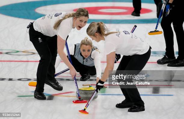 Anna Sloan of Great Britain throws a stone surrounded by teammates Lauren Gray and Vicki Adams during the women's curling semifinal game between...