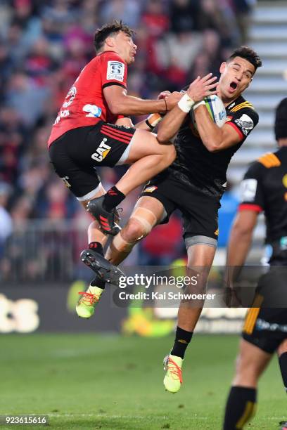 Shaun Stevenson of the Chiefs is tackled by David Havili of the Crusaders during the round two Super Rugby match between the Crusaders and the Chiefs...