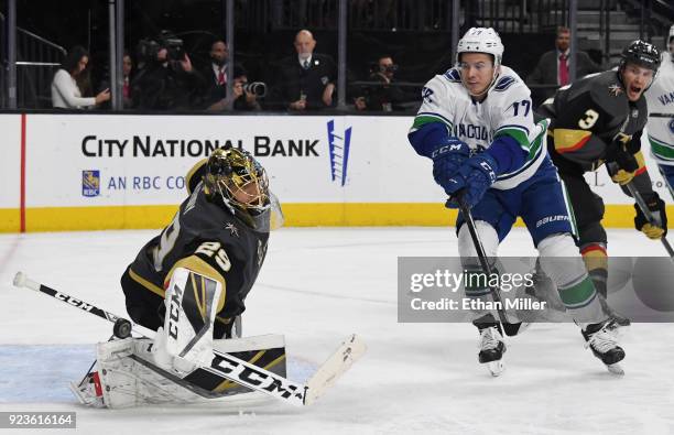 Marc-Andre Fleury of the Vegas Golden Knights blocks a shot in front of Nikolay Goldobin of the Vancouver Canucks in the third period of their game...