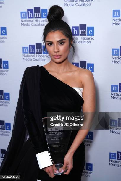 Actor Diane Guerrero poses with the 'Lupe Ontiveros Indomitable Spirit Award' during the 21st Annual National Hispanic Media Coalition Impact Awards...