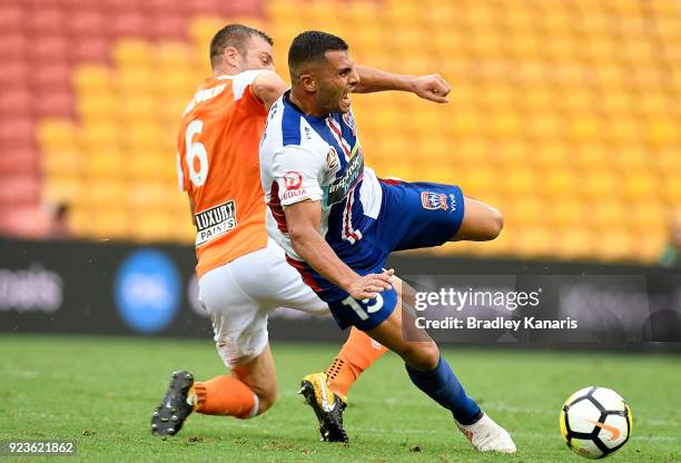 Andrew Nabbout of the Jets is tackled by Avram Papadopoulos of the Roar during the round 21 A-League match between the Brisbane Roar and the...