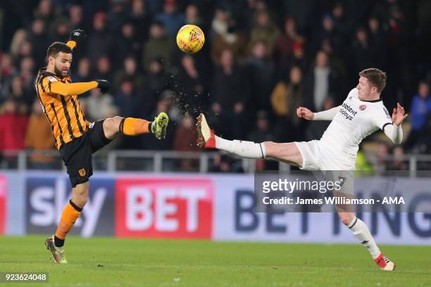Fraizer Campbell of Hull City and John Lundstram of Sheffield United during the Sky Bet Championship match between Hull City and Sheffield United at...