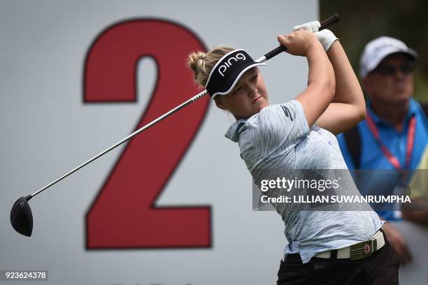 Golfer Brooke Henderson tees off during the Honda LPGA golf tournament at the Siam Country Club in the coastal Thai province of Chonburi on February...