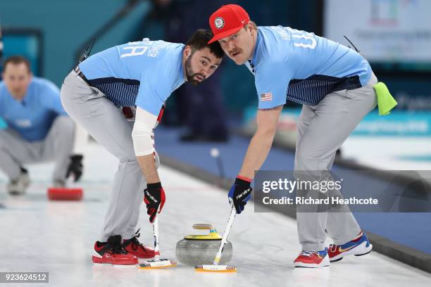 Matt Hamilton and John Landsteiner of the United States deliver a stone against Sweden during the Curling Men's Gold Medal game on day fifteen of the...