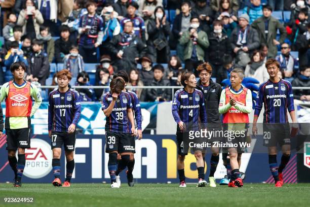 Players of Gamba Osaka show their dejection after the J.League J1 match between Gamba Osaka and Nagoya Grampus at Suita City Football Stadium on...