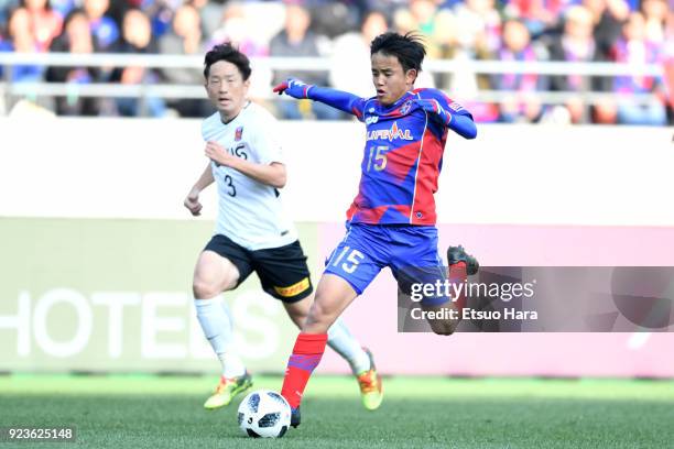 Takefusa Kubo of FC Tokyo and Tomoya Ugajin of Urawa Red Diamonds compete for the ball during the J.League J1 match between FC Tokyo and Urawa Red...