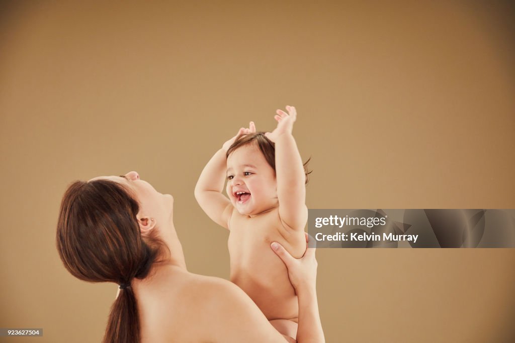 Mother playing with baby boy (11-12 months)