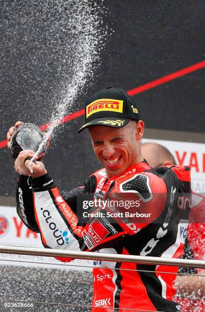 Marco Melandri of Italy and Aruba.it Racing - Ducati sprays champagne as he celebrates on the podium after winning race 1 in the FIM Superbike World...