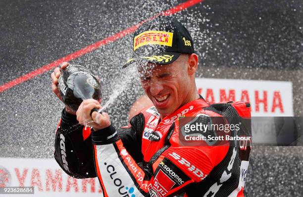 Marco Melandri of Italy and Aruba.it Racing - Ducati sprays champagne as he celebrates on the podium after winning race 1 in the FIM Superbike World...