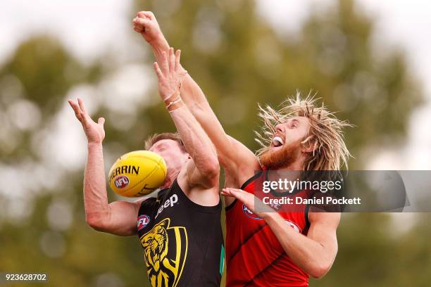 Dyson Heppell of the Bombers spoils the ball during the JLT Community Series AFL match between the Essendon Bombers and the Richmond Tigers at Norm...