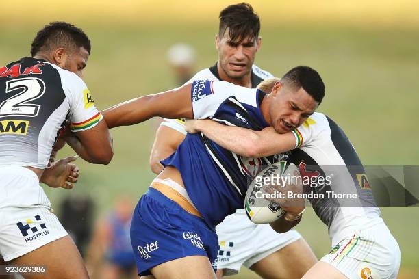 Renouf To'omaga of the Bulldogs is tackled by the Panthers defence during the NRL trial match between the Penrith Panthers ands the Canterbury...