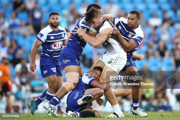 James Tamou of the Panthers is tackled by the Bulldogs defence during the NRL trial match between the Penrith Panthers ands the Canterbury Bulldogs...