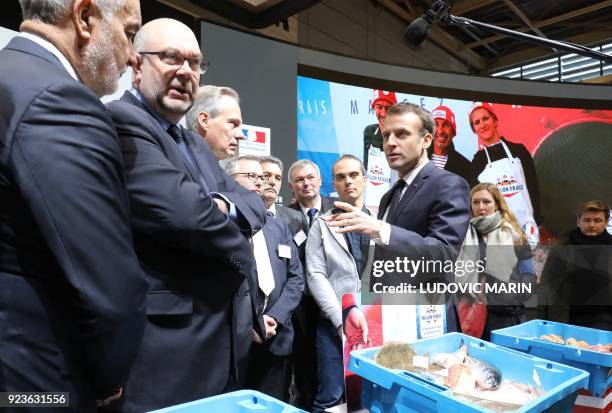 French President Emmanuel Macron visits the 55th International Agriculture Fair with French Agriculture Minister Stéphane Travert at the Porte de...