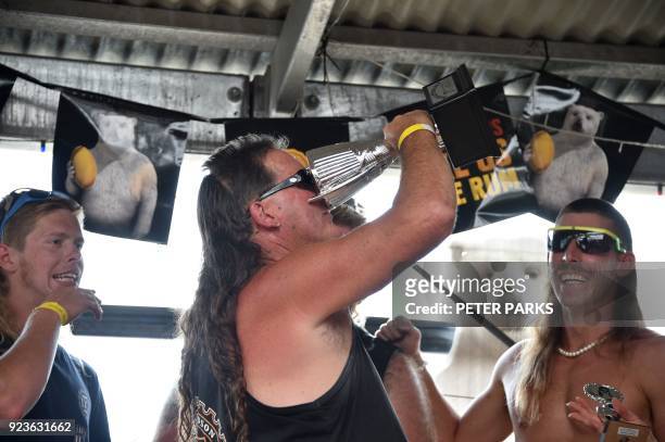 Thirty-one-year-old Australian Shane Hanrahan celebrates after winning the "best mullet" award at Mulletfest 2018 in the town of Kurri Kurri, 150 kms...