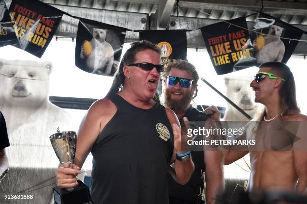 Thirty-one-year-old Australian Shane Hanrahan celebrates after winning the "best mullet" award at Mulletfest 2018 in the town of Kurri Kurri, 150 kms...