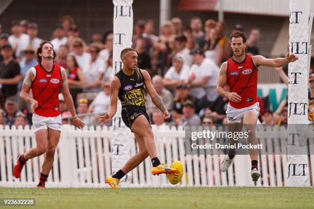 Shai Bolton of the Tigers kicks a goal during the JLT Community Series AFL match between the Essendon Bombers and the Richmond Tigers at Norm Minns...