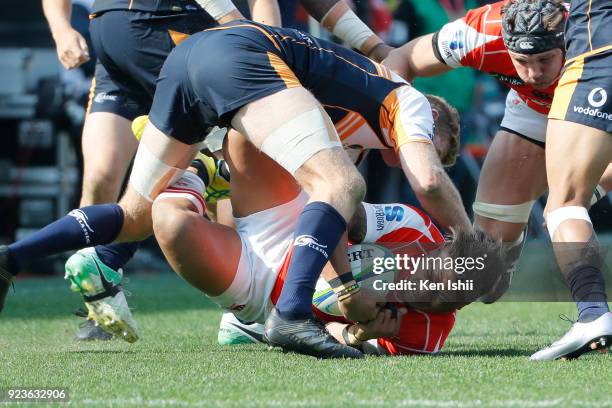 Lomano Lemeki of the Sunwolves is tackled during the Super Rugby round 2 match between Sunwolves and Brumbies at the Prince Chichibu Memorial Ground...