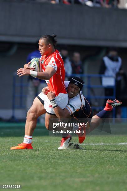 Jason Emery of the Sunwolves is tackled by Christian Lealiifano of the Brumbies during the Super Rugby round 2 match between Sunwolves and Brumbies...