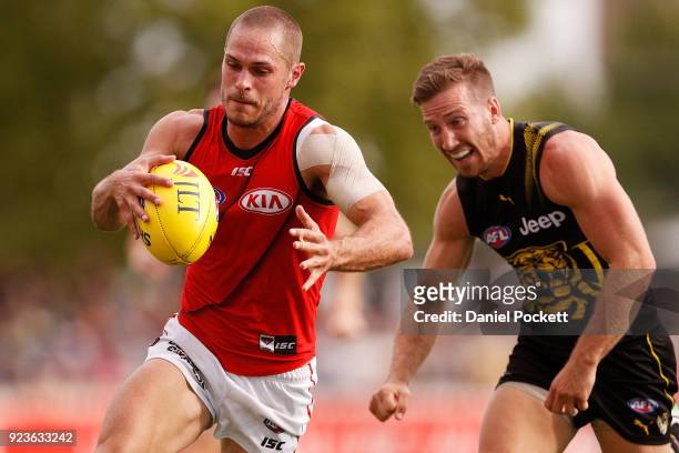 David Zaharakis of the Bombers kicks the ball during the JLT Community Series AFL match between the Essendon Bombers and the Richmond Tigers at Norm...
