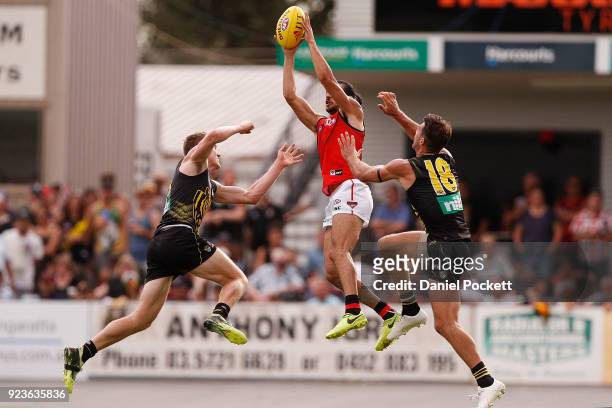 Jake Long of the Bombers flies for a mark during the JLT Community Series AFL match between the Essendon Bombers and the Richmond Tigers at Norm...