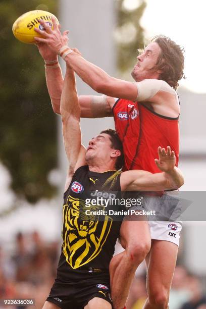 Michael Hartley of the Bombers marks the ball during the JLT Community Series AFL match between the Essendon Bombers and the Richmond Tigers at Norm...