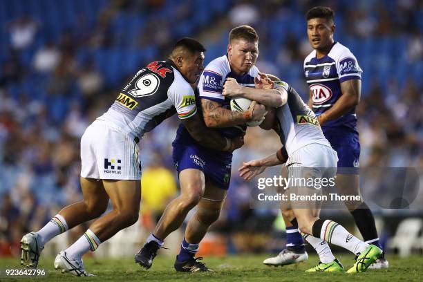 Greg Eastwood of the Bulldogs is tackled by the Panthers defence during the NRL trial match between the Penrith Panthers ands the Canterbury Bulldogs...