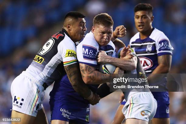 Greg Eastwood of the Bulldogs is tackled by the Panthers defence during the NRL trial match between the Penrith Panthers ands the Canterbury Bulldogs...