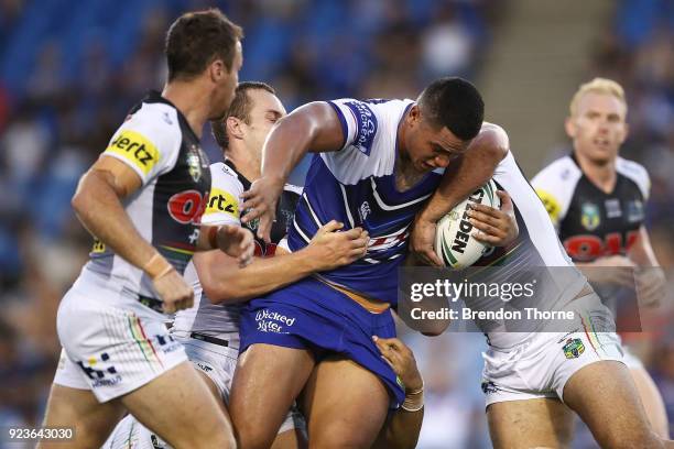 Renouf To'omaga of the Bulldogs is tackled by the Panthers defence during the NRL trial match between the Penrith Panthers ands the Canterbury...