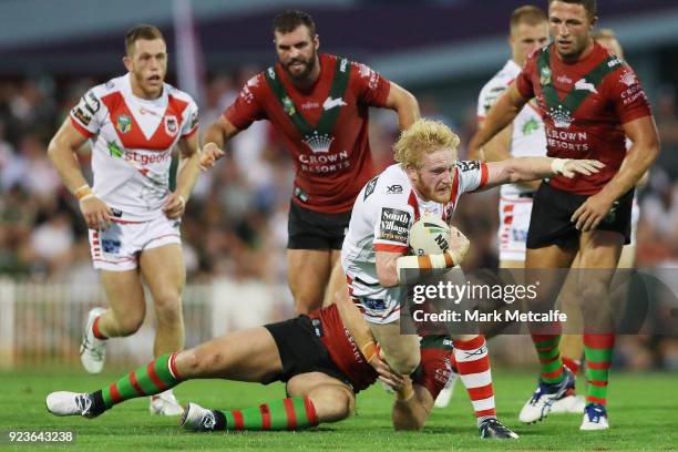 James Graham of the Dragons is tackled during the NRL trial match between the South Sydney Rabbitohs and the St George Illawarra Dragons at Glen...