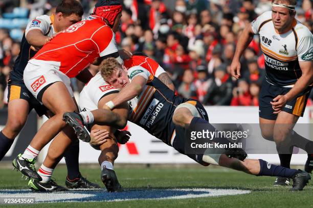 Thomas Cusack of the Brumbies tackles during the Super Rugby round 2 match between Sunwolves and Brumbies at the Prince Chichibu Memorial Ground on...