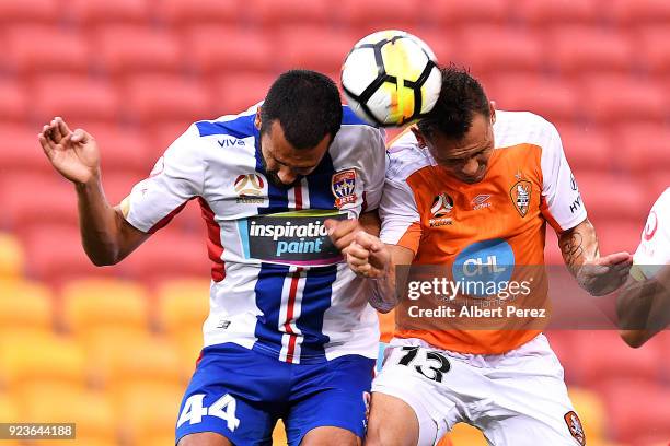 Nikolai Topor-Stanley of the Jets and Jade North of the Roar challenge for the ball during the round 21 A-League match between the Brisbane Roar and...