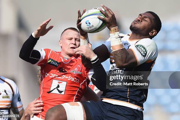 Robbie Robinson of the Sunwolves competes for the ball against Isi Naisarani of the Brumbies during the Super Rugby round 2 match between Sunwolves...