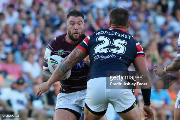 Curtis Sironen of the Sea Eagles is tackled by the Roosters defence during the NRL Trial match between the Manly Sea Eagles and the Sydney Roosters...