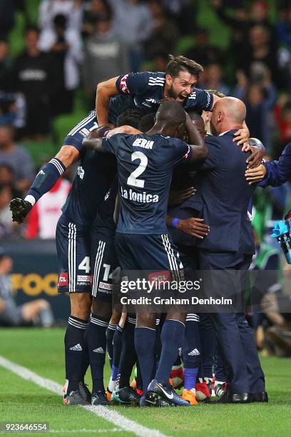 Leroy George of the Victory celebrates his goal with his teammates and Melbourne Victory Head Coach Kevin Muscat during the round 21 A-League match...