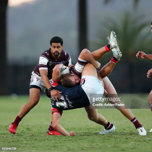 Jake Trbojevic of the Sea Eagles tackles Lindsay Collins of the Roosters during the NRL Trial match between the Manly Sea Eagles and the Sydney...