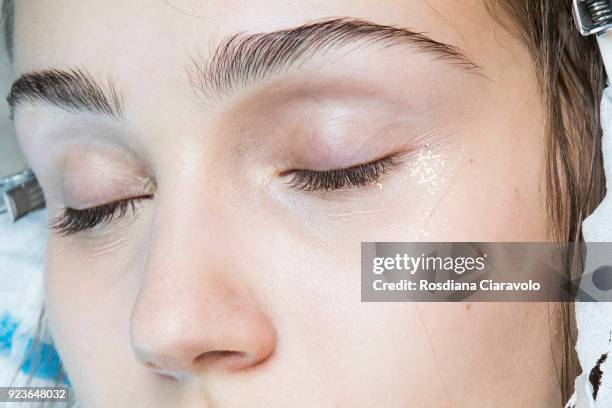 Model, make up detail, is seen backstage ahead of the N.21 show during Milan Fashion Week Fall/Winter 2018/19 on February 21, 2018 in Milan, Italy.