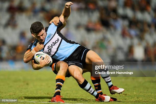 Chad Townsend of the Sharks is tackled by Josh Reynolds of the Tigers during the NRL trial match between the Cronulla Sharks and the Wests Tigers at...