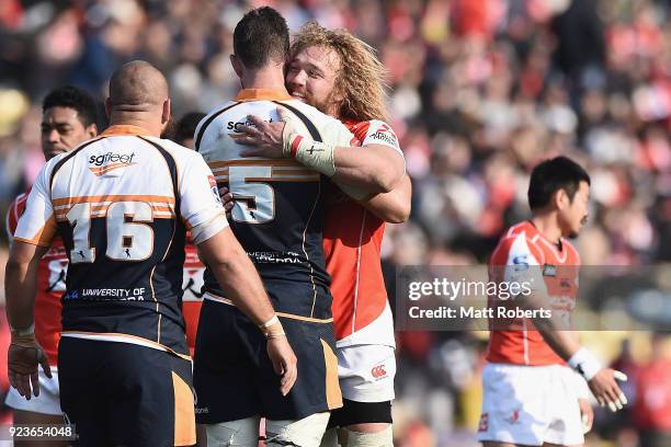 Willem Britz of the Sunwolves hugs Sam Carter of the Brumbies after the Super Rugby round 2 match between Sunwolves and Brumbies at the Prince...