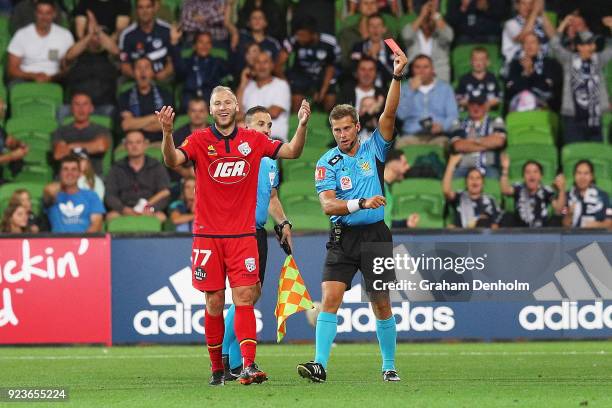 Dzengis Cavusevic of United is shown a red card by refree Alex King during the round 21 A-League match between the Melbourne Victory and Adelaide...