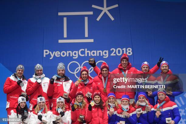 Austria's silver medallists Stephanie Brunner, Katharina Gallhuber, Katharina Liensberger, Manuel Feller, Michael Matt and Marco Schwarz,...