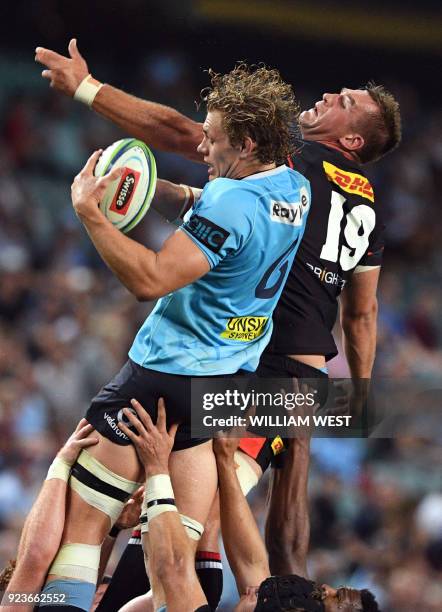 Australia's Waratahs flanker Ned Hanigan takes in the lineout ball ahead of South Africa's Stormers player Chris van Zyl during their Super rugby...