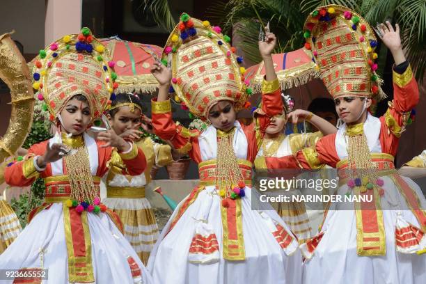 Indian schoolchildren perform a traditional Kathakali dance during a function at a school in Amritsar on February 24, 2018. / AFP PHOTO / NARINDER...