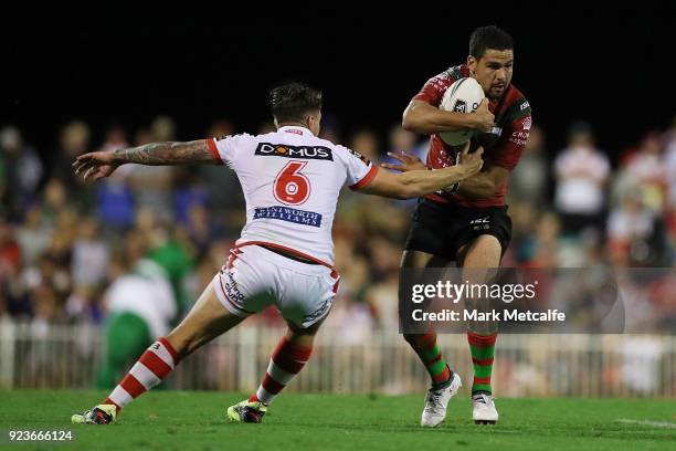 Braidon Burns of the Rabbitohs is tackled by Gareth Widdop of the Dragons during the NRL trial match between the South Sydney Rabbitohs and the St...