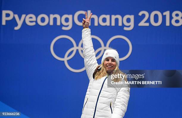 Czech Republic's gold medallist Ester Ledecka celebrates on the podium during the medal ceremony for the snowboard women's parallel giant slalom at...