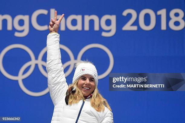 Czech Republic's gold medallist Ester Ledecka celebrates on the podium during the medal ceremony for the snowboard women's parallel giant slalom at...