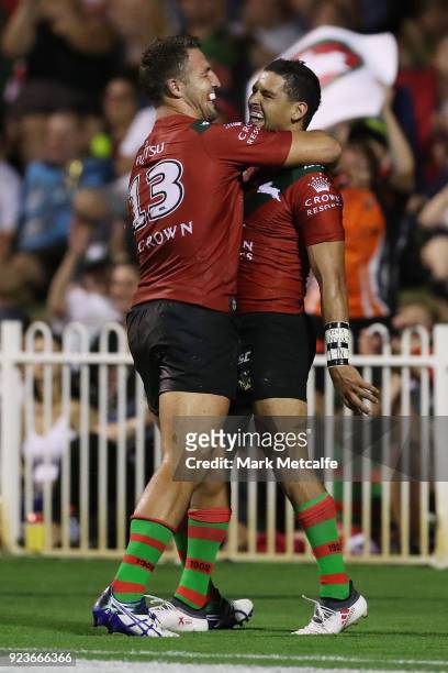 Cody Walker of the Rabbitohs celebrates scoring a try with team mate Sam Burgess of the Rabbitohs during the NRL trial match between the South Sydney...